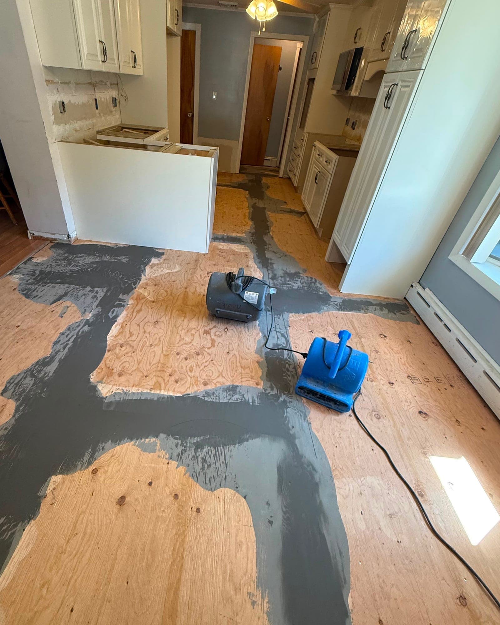 Plywood underlayment with localized patching during a Farmington kitchen flooring installation