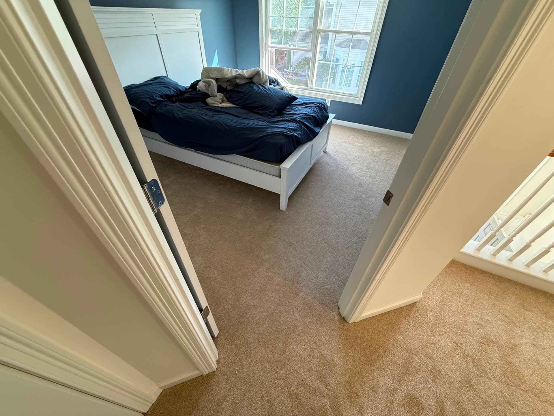 Carpet across an upstairs landing outside the bedrooms in a Newington home