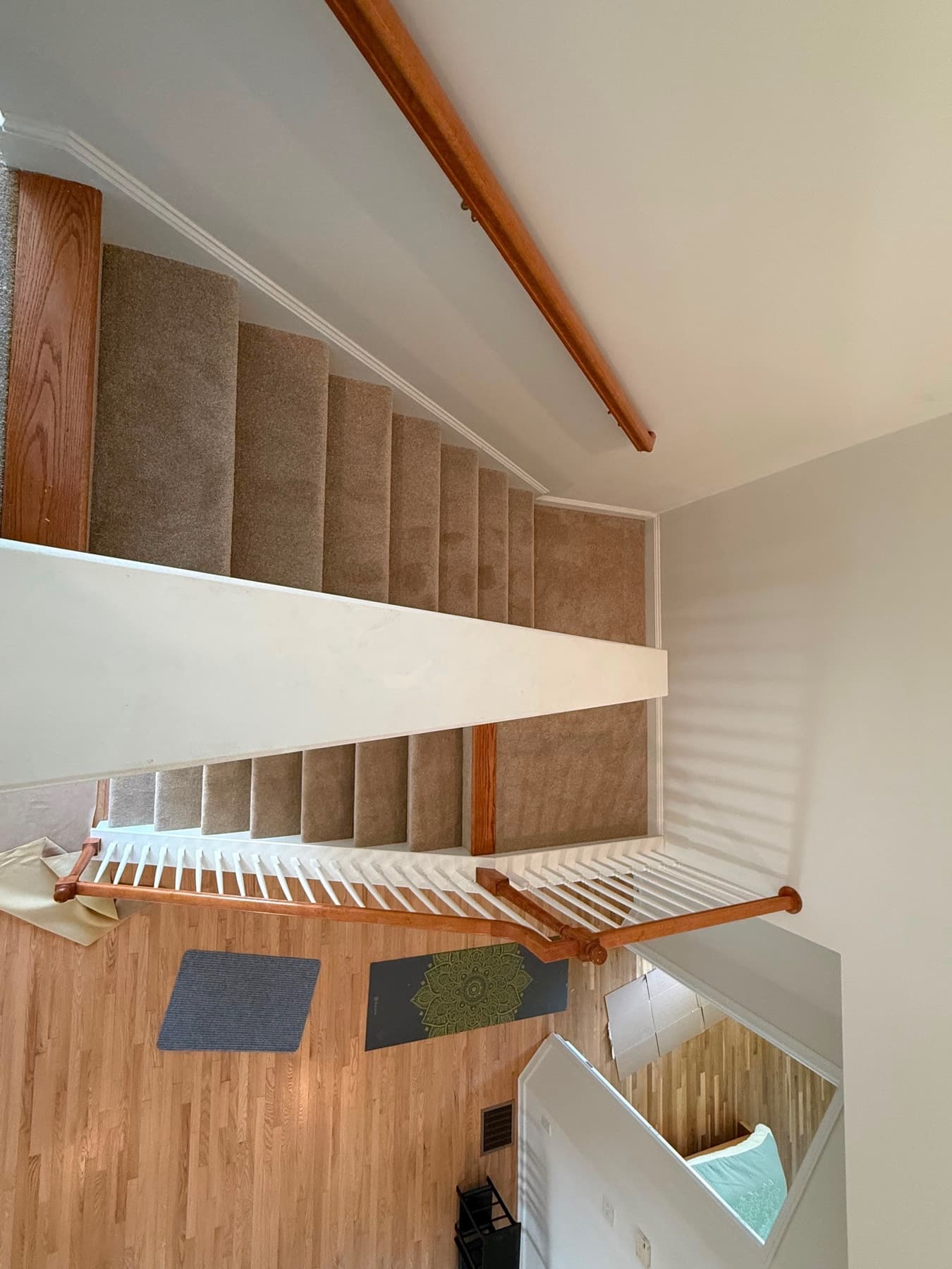Carpeted upper landing beside the staircase in a Newington home