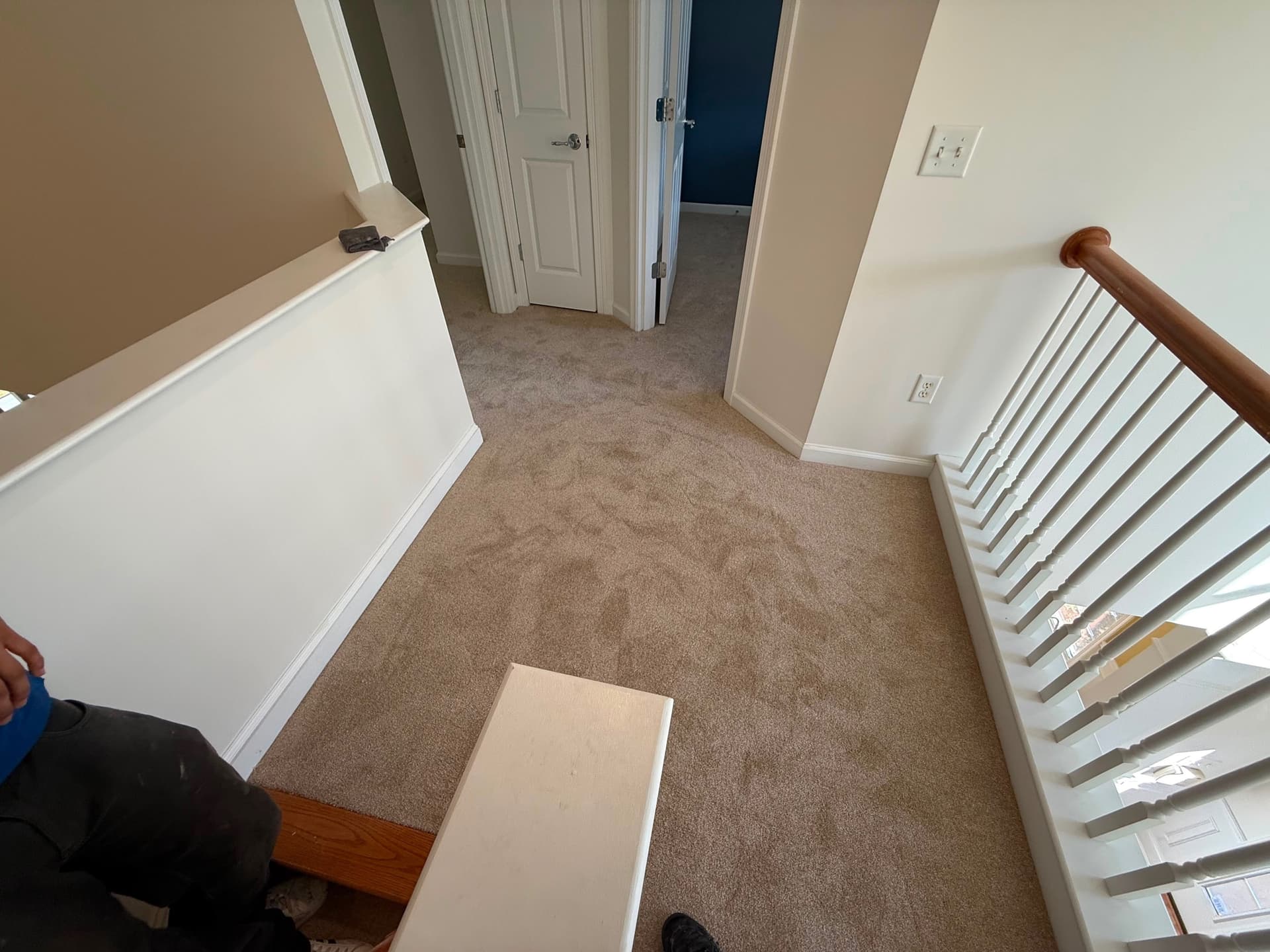 Carpet fitted over the treads of an interior staircase in Newington