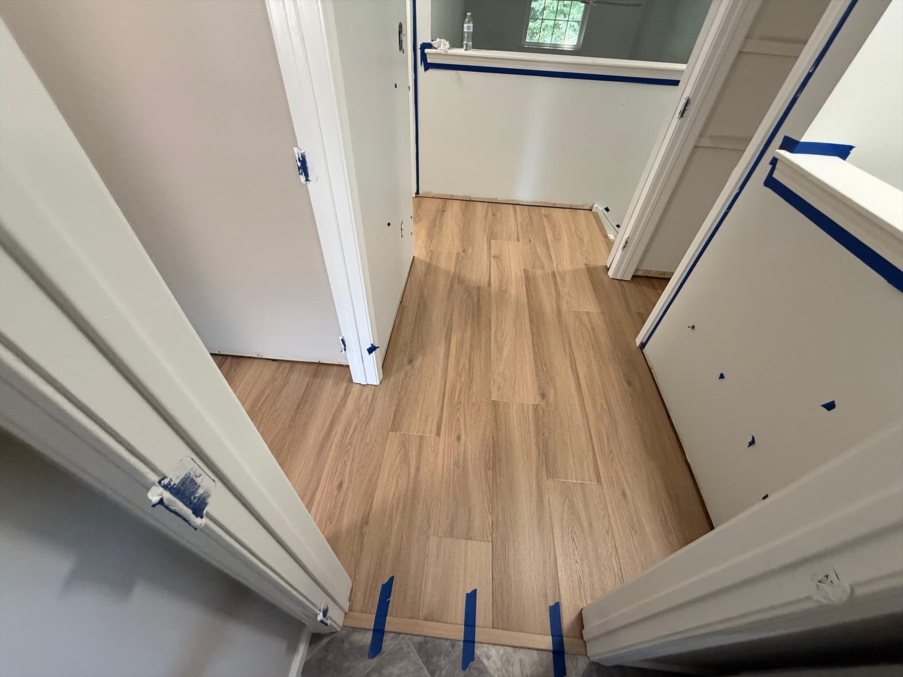 Tarkett ProGen Plus Bespoke Oak Autumn click LVP installed at a Plainville condominium stair landing during Phase 1