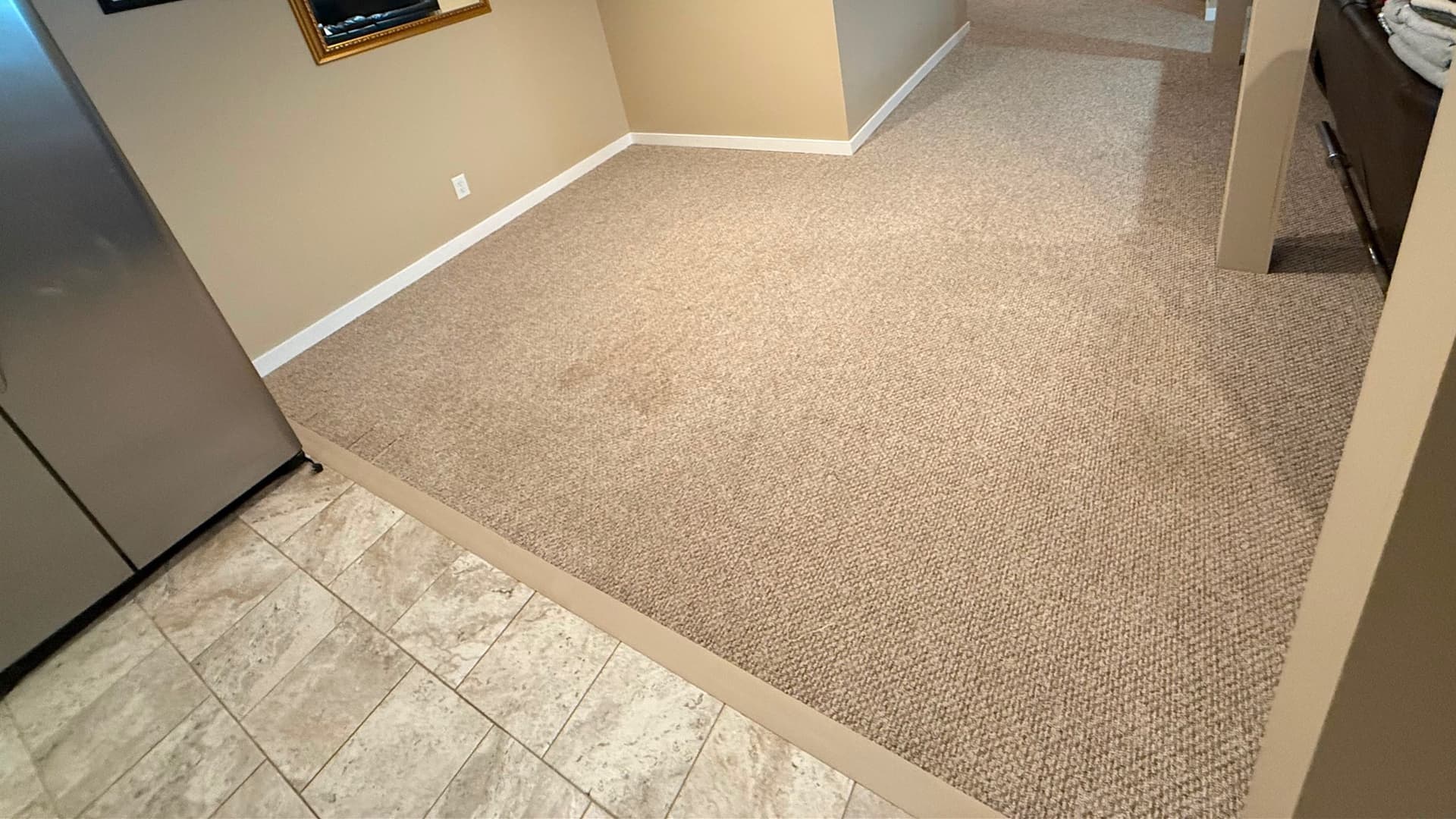 Finished basement carpet after a restretch and pad replacement in Kensington, Connecticut
