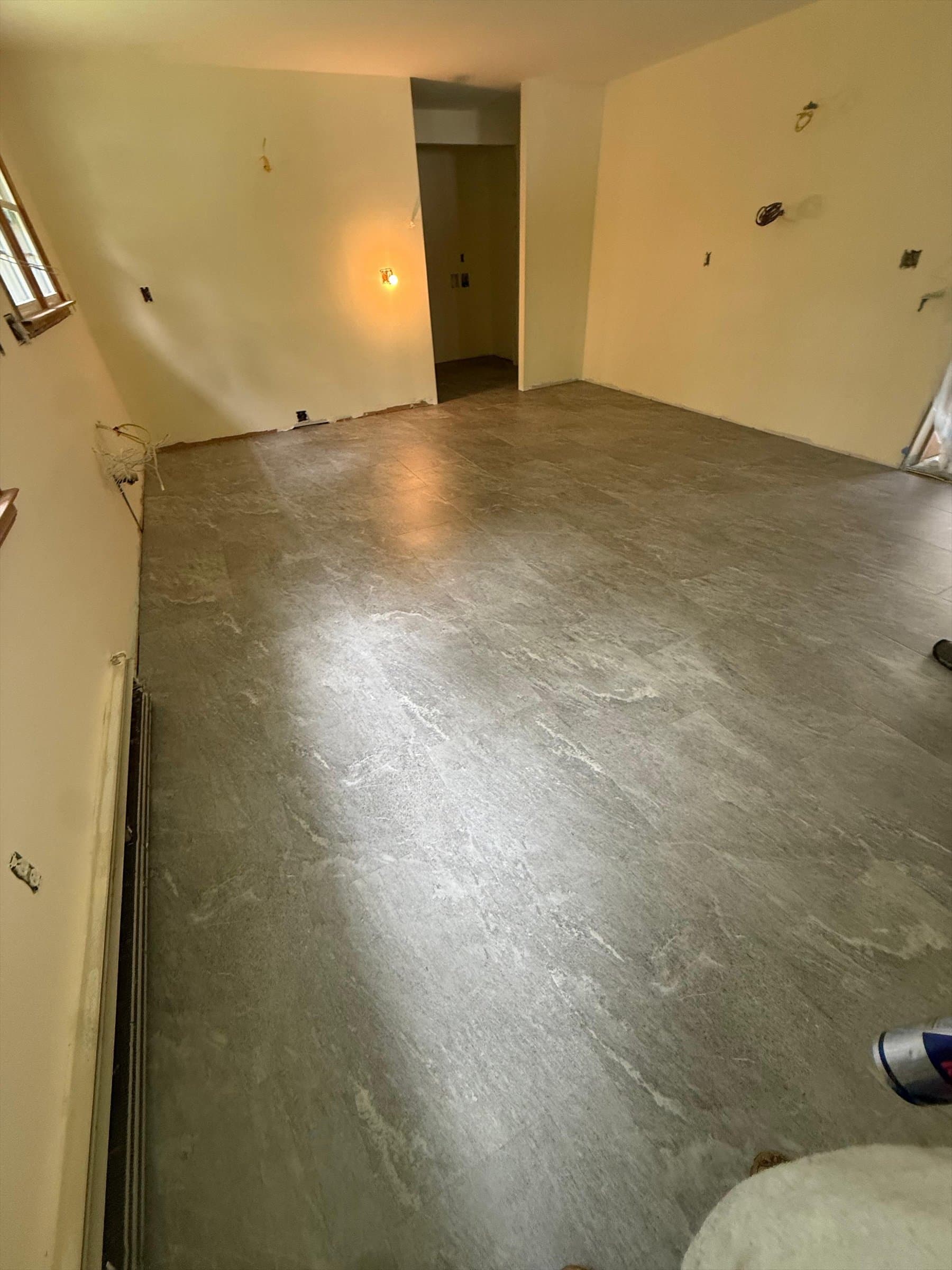 Completed Karndean Art Select Sterling Quartzite gluedown LVT floor in a Kensington kitchen under renovation