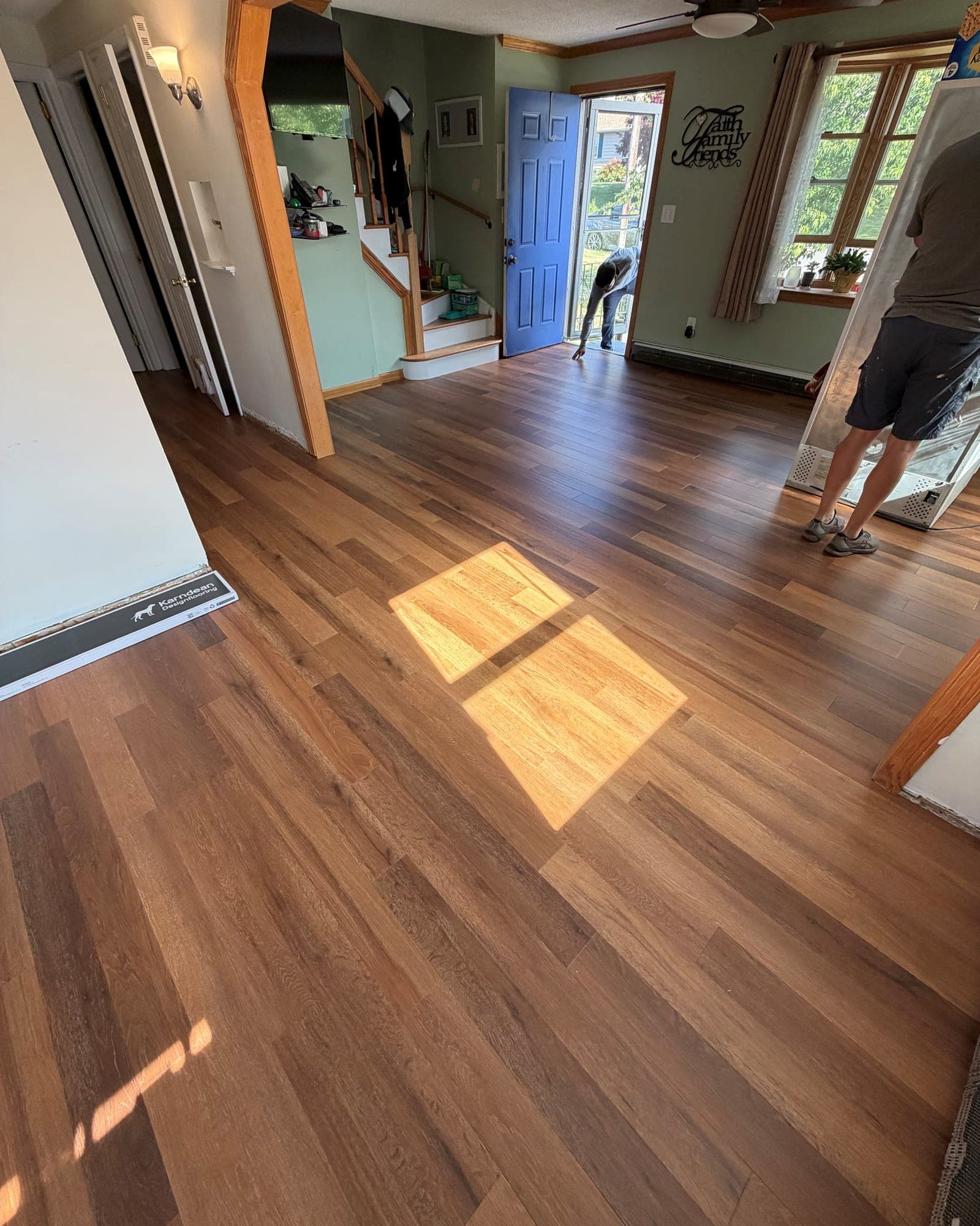 Karndean Art Select Golden Kent Ash flooring installed across a Bristol living room beside the entry and staircase