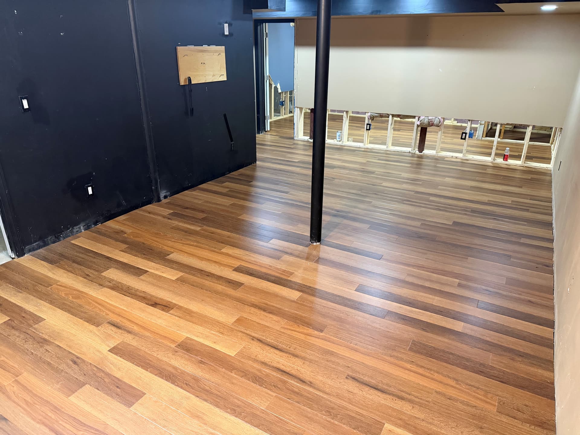 Karndean Golden Kent Ash floating luxury vinyl flooring installed across a Colchester basement during renovation