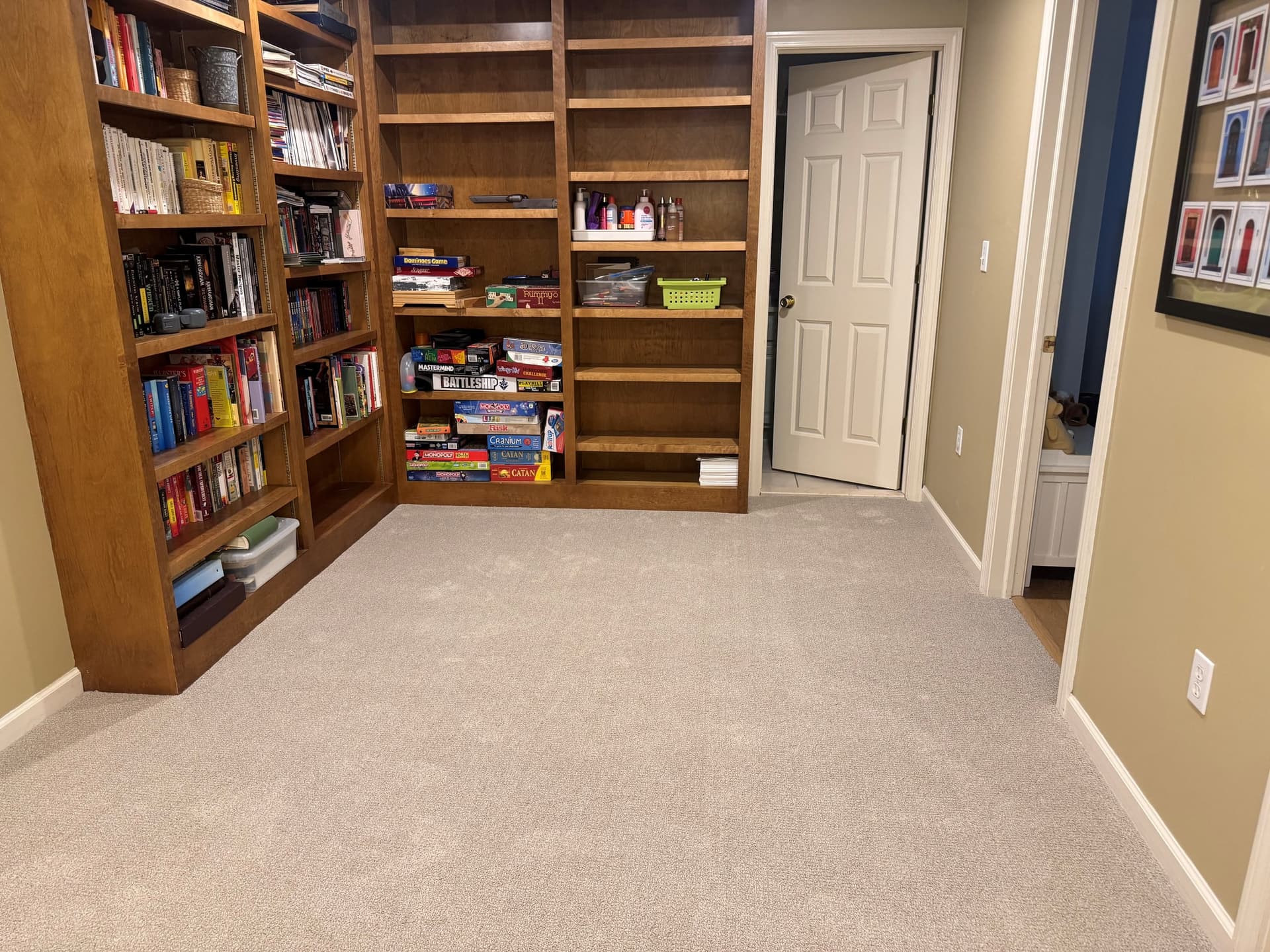 Engineered Floors Pinpoint carpet in Fieldcrest fitted around built-in wooden bookshelves and hallway doorways