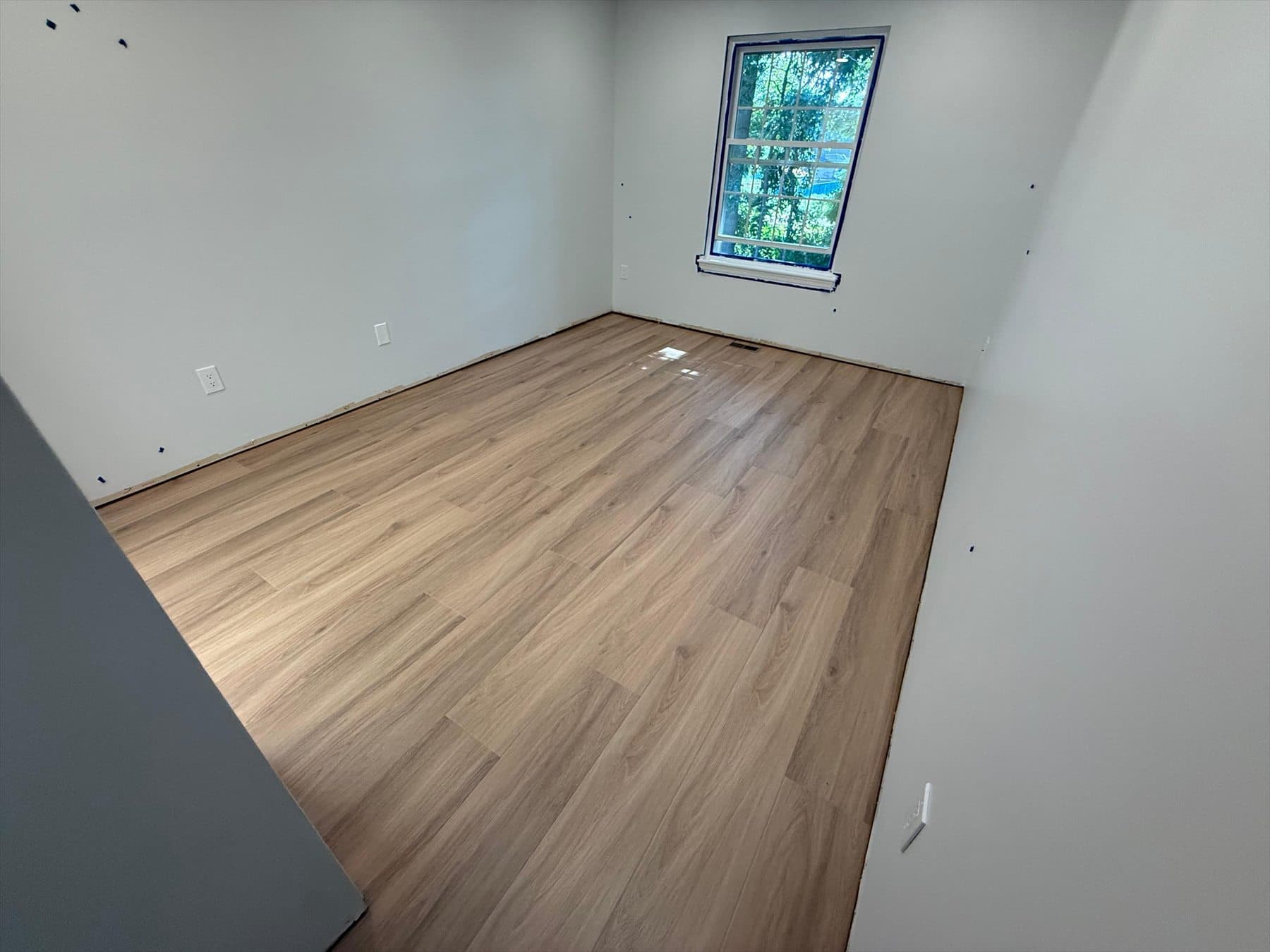 Tarkett ProGen Plus Bespoke Oak Autumn click LVP installed during Phase 1 in a Plainville condominium bedroom
