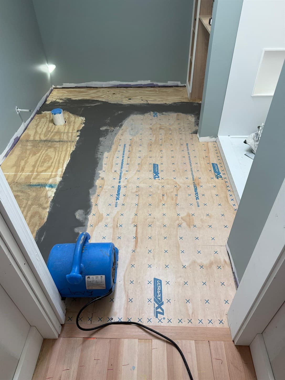 Ultraply underlayment and Planiprep seam preparation in progress in a Windsor primary bathroom